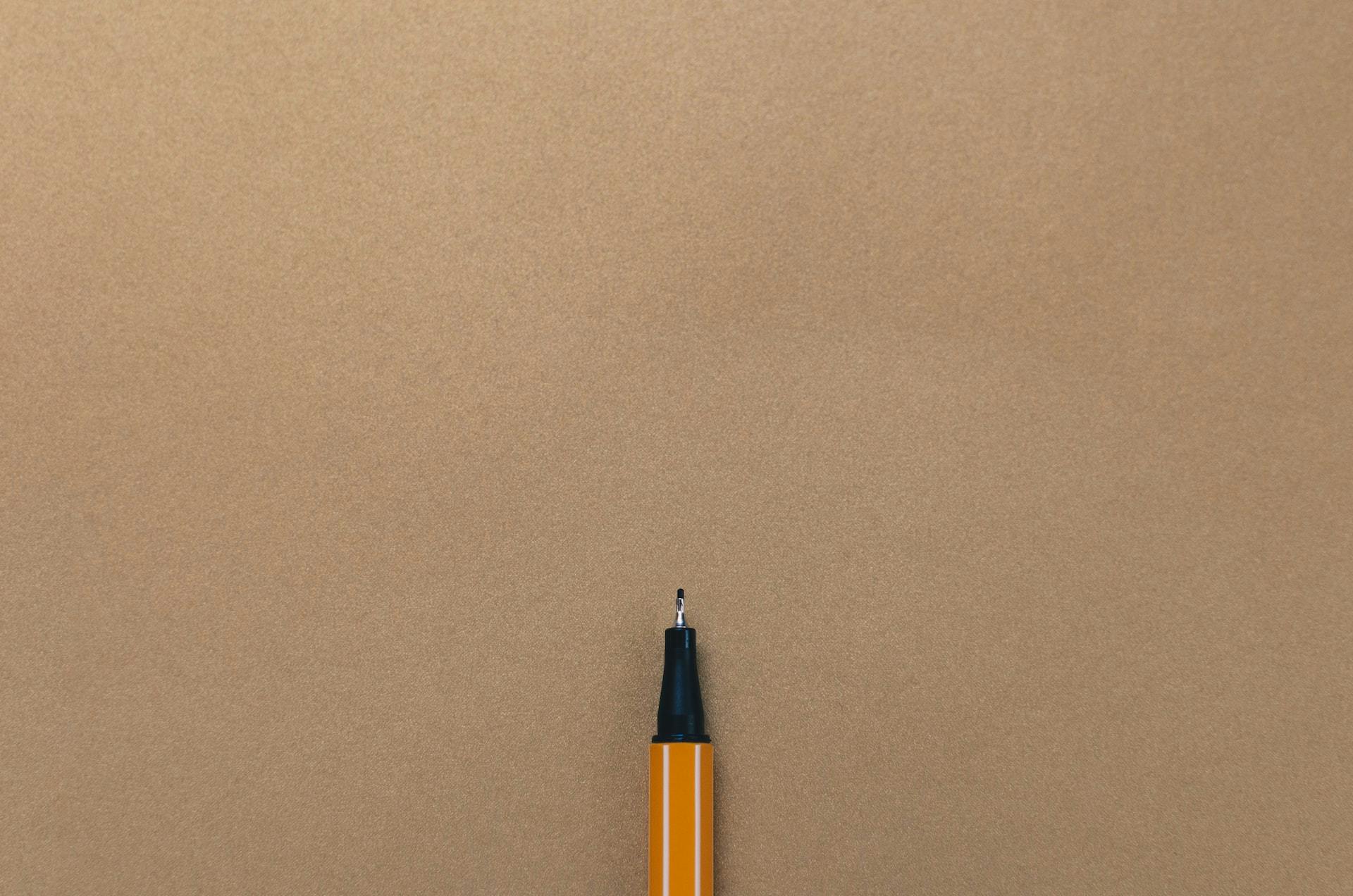 Single pen on a beige background